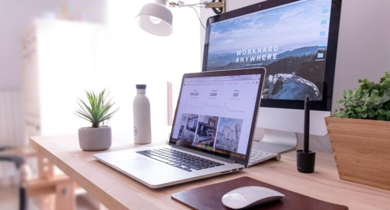 Laptop showing a website dashboard on a bright desk