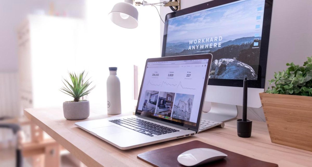 Laptop showing a website dashboard on a bright desk